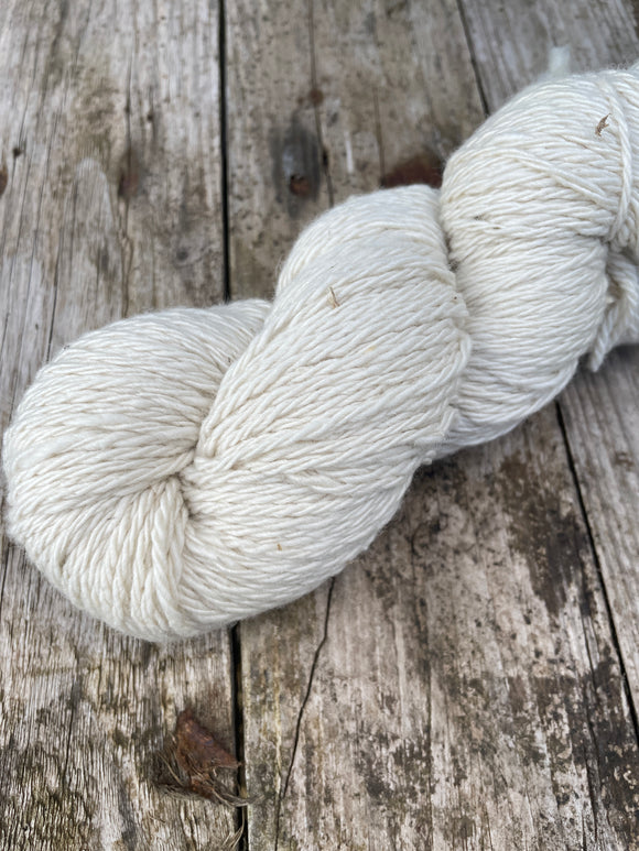 photo shows 1 skein of La Bella yarn in creme colour. The yarn in the photo is an aran weight or 10-12 ply.