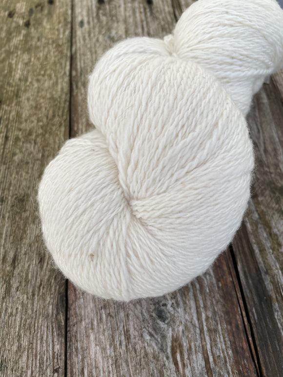 Image shows 1 skein of natural white merino yarn looking super soft